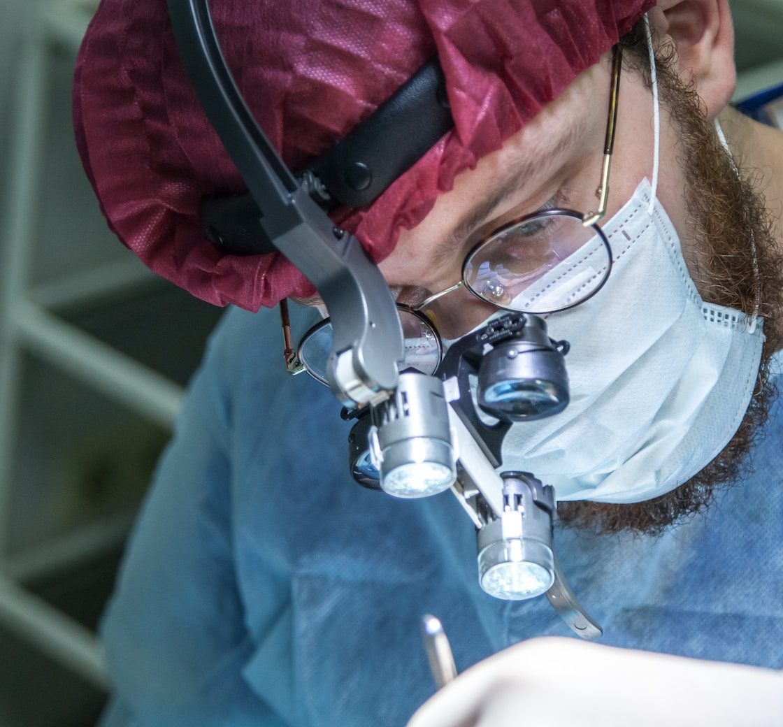man wearing head microscope